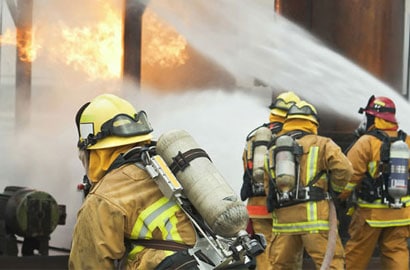 Fire fighters putting out a fire.