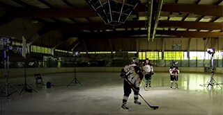 Hockey players line up on the ice to take shots at breaking the glass and test the strength of 3M product, ETFE.
