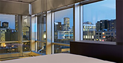 From a hotel bed, guests have an unobscured view of the downtown skyline.
