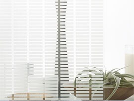 At etched-look pattern is created on an interior office window using 3M™ Fasara™ Glass Finishes.