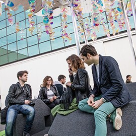 Some Milan Design Week attendees resting under the Urban Tree-Lounge.
