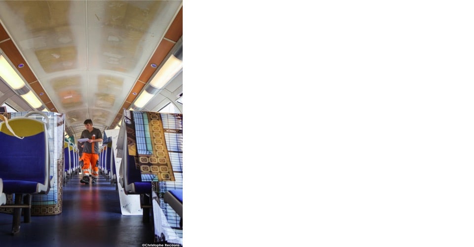 Interior of Paris train ceiling covered in 3M graphic film that displays classic artwork above the heads of passengers.