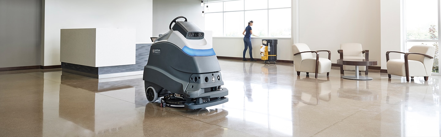 Image of floor polishing machine in a room with highly polished floors
