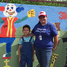 3Mer Laura Rejas with Danny, a kid who wants to be a painter when he grows up.